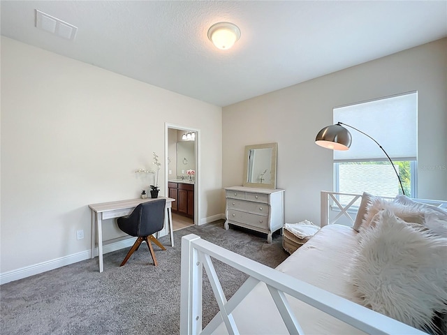 bedroom featuring carpet floors and ensuite bath