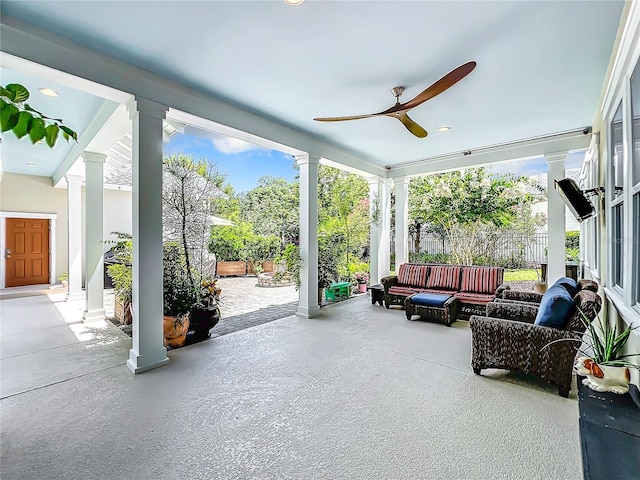 sunroom / solarium with decorative columns and ceiling fan