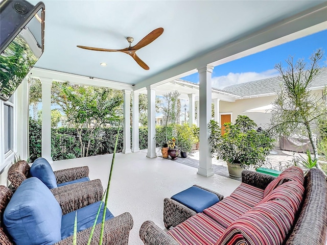 sunroom / solarium with ceiling fan