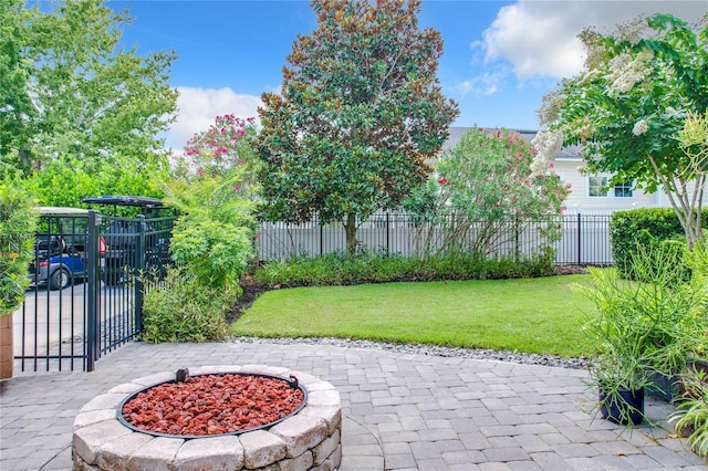 view of patio with an outdoor fire pit