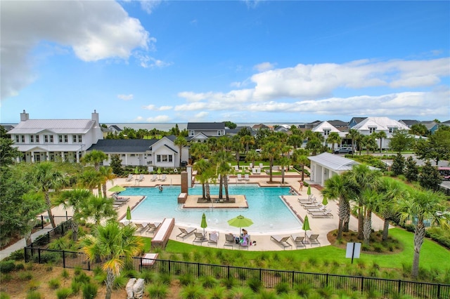 view of swimming pool featuring a yard and a patio