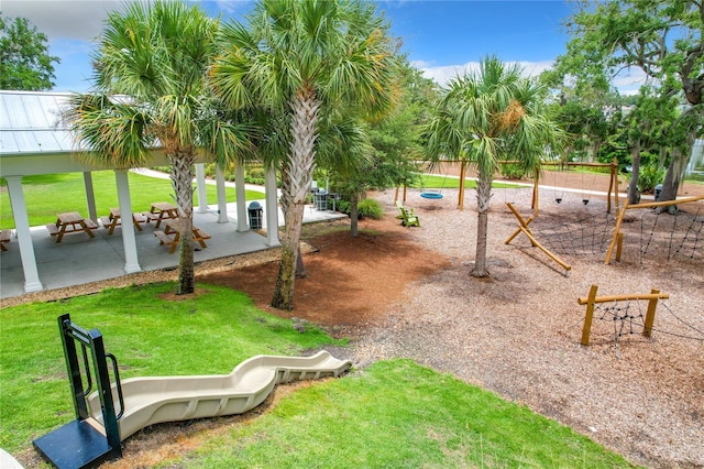 view of community with a yard and a playground