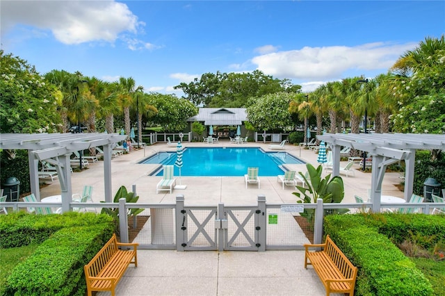 view of swimming pool featuring a pergola and a patio area