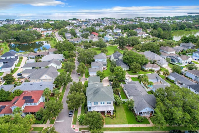 bird's eye view with a water view