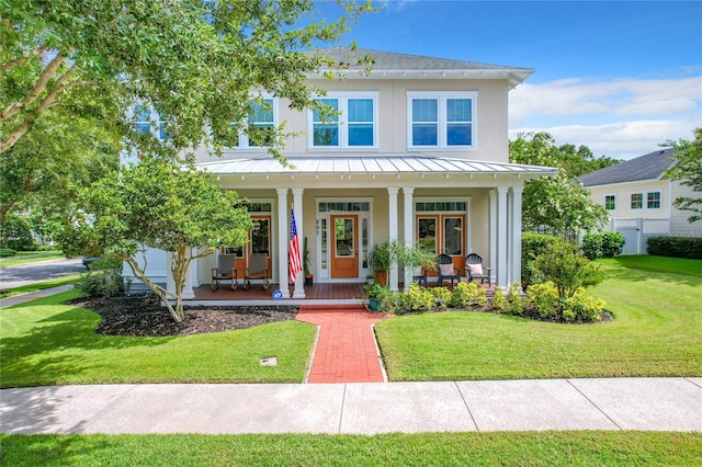 view of front facade featuring a porch and a front lawn