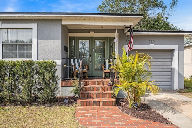 view of exterior entry featuring a garage