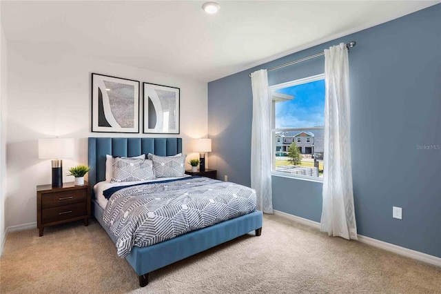 bedroom with light colored carpet