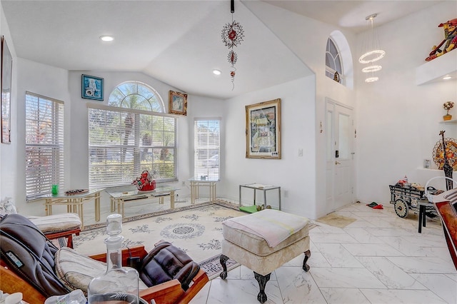 sitting room with lofted ceiling