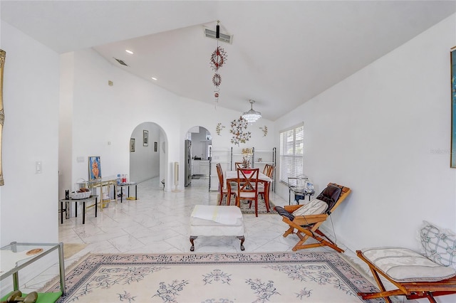 interior space featuring a towering ceiling