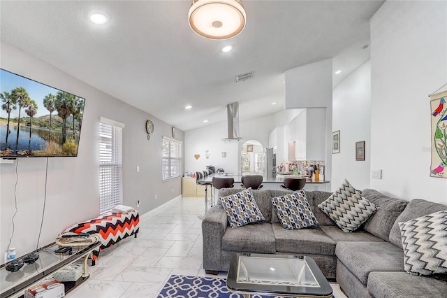 living room featuring vaulted ceiling