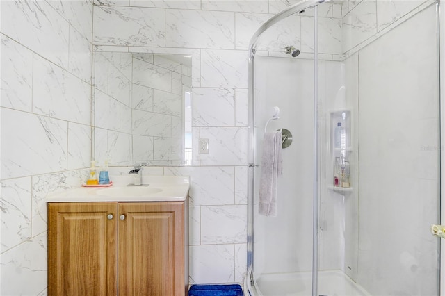 bathroom with vanity and a shower with door