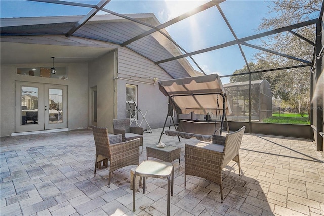 view of patio featuring french doors, an outdoor living space, and a lanai