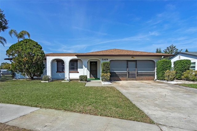 single story home with a garage and a front yard