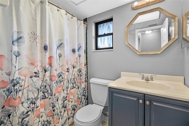 bathroom with vanity, toilet, and a shower with shower curtain