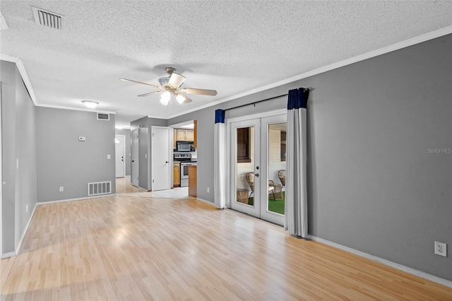 unfurnished living room featuring light hardwood / wood-style flooring, ornamental molding, french doors, and ceiling fan