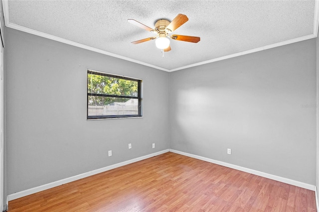 empty room featuring crown molding and light hardwood / wood-style flooring