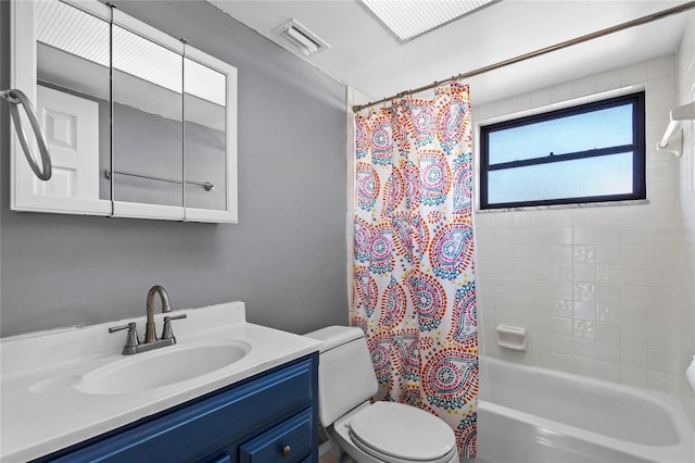 full bathroom featuring vanity, toilet, and shower / tub combo with curtain