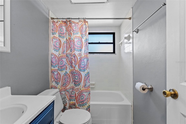 full bathroom with vanity, shower / bath combination with curtain, and toilet