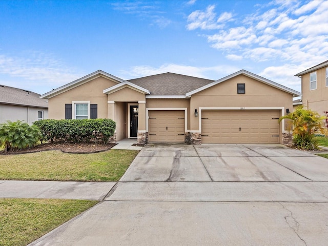 view of front facade featuring a garage and a front lawn