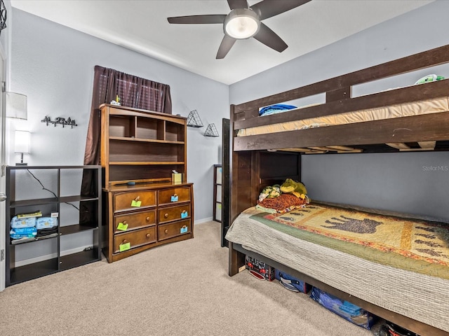 bedroom with ceiling fan and carpet flooring