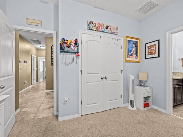 interior space featuring ensuite bathroom and a closet