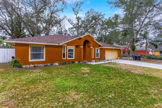 single story home featuring a garage and a front lawn