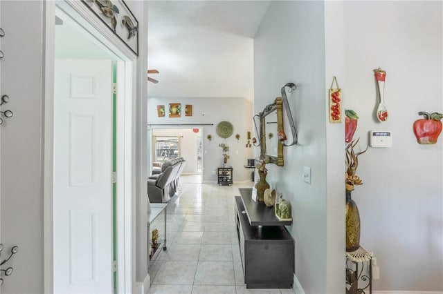 corridor featuring light tile patterned floors