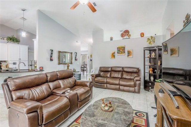 tiled living room featuring vaulted ceiling, sink, and ceiling fan