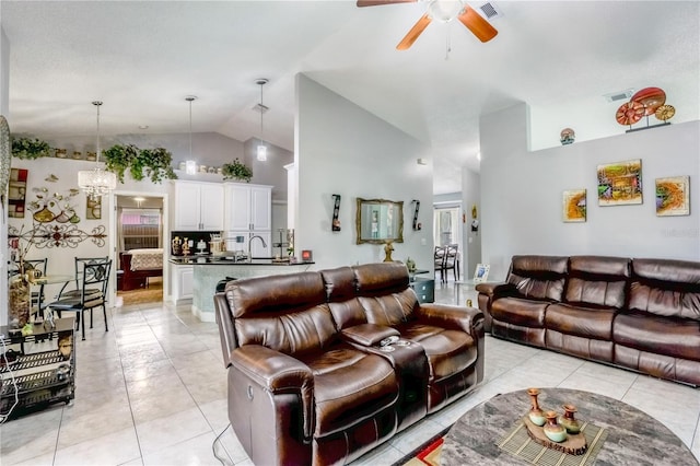 tiled living room with high vaulted ceiling, sink, and ceiling fan