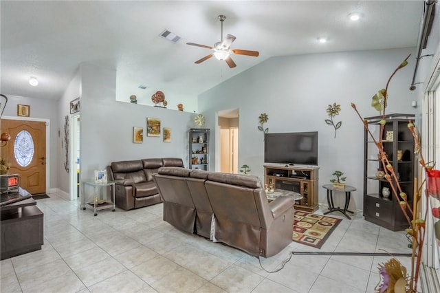 tiled living room featuring lofted ceiling and ceiling fan