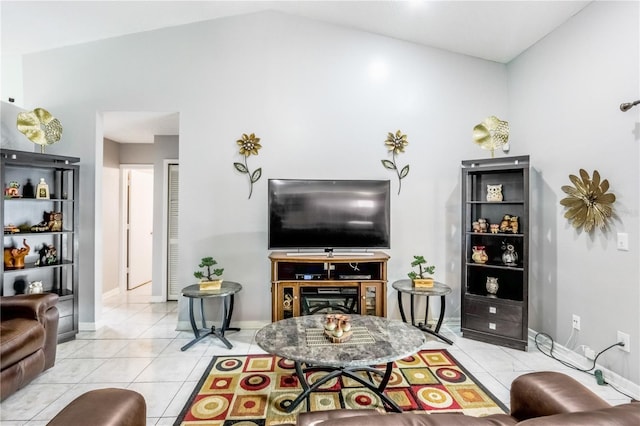 living room featuring lofted ceiling and light tile patterned floors