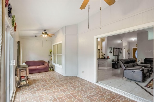 interior space featuring ceiling fan