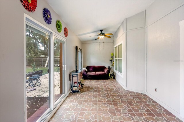 sunroom / solarium featuring vaulted ceiling and ceiling fan