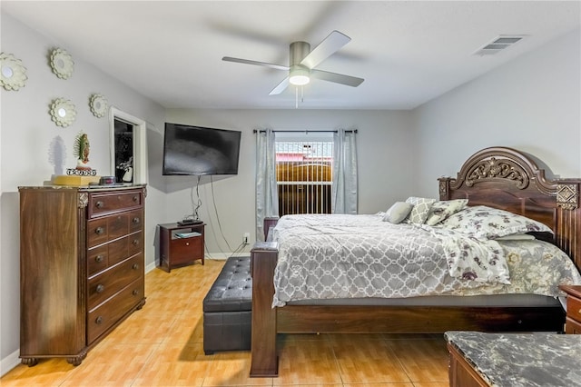 bedroom with ceiling fan and light hardwood / wood-style flooring