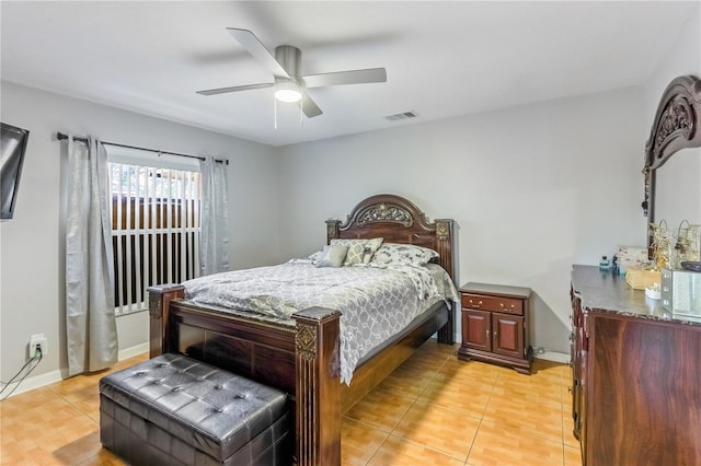 tiled bedroom with ceiling fan