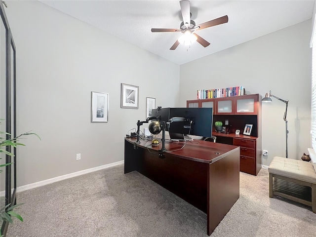 carpeted office with ceiling fan