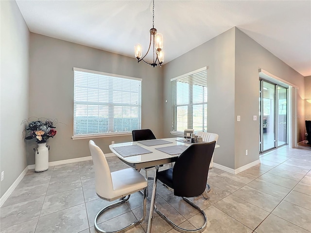 dining space featuring an inviting chandelier and light tile patterned flooring