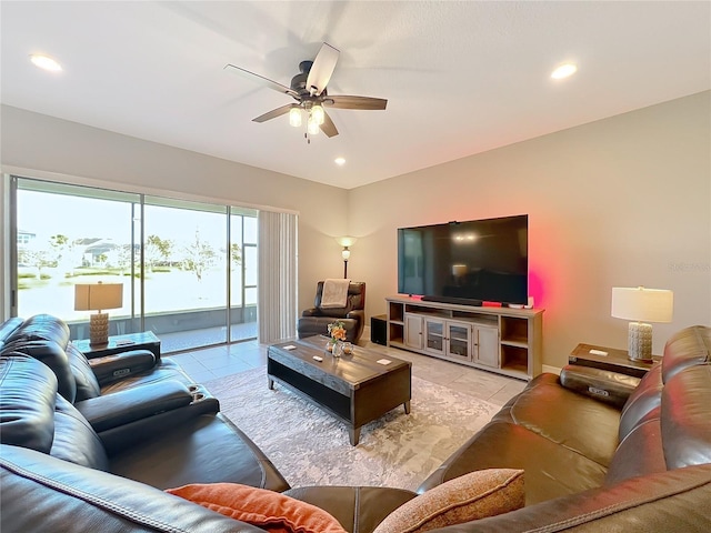 living room featuring ceiling fan and light tile patterned floors