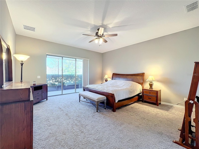 bedroom with light carpet, access to exterior, and ceiling fan