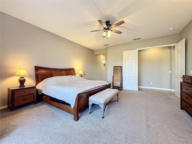 bedroom with lofted ceiling, light colored carpet, and ceiling fan