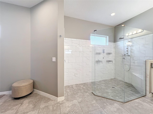 bathroom featuring tiled shower