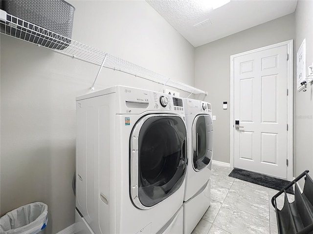 laundry area with washer and dryer