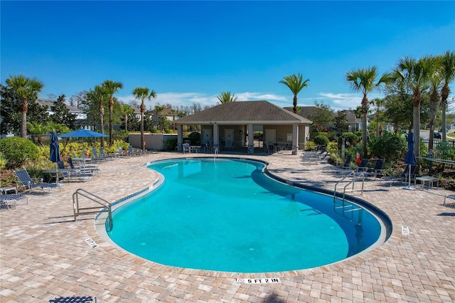 view of swimming pool with a patio area