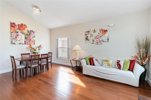 living room with lofted ceiling and hardwood / wood-style floors