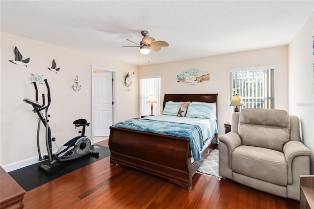 bedroom with hardwood / wood-style floors and ceiling fan