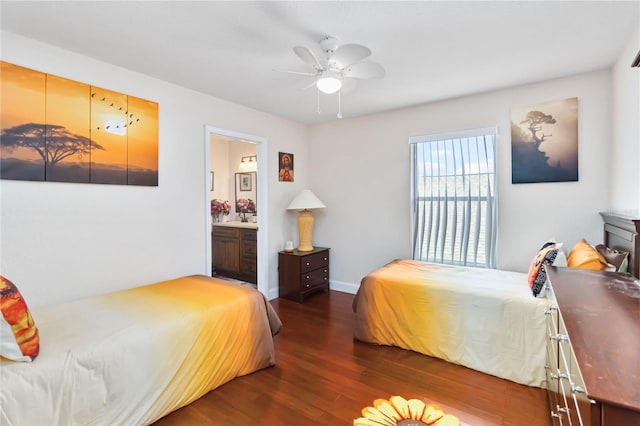 bedroom with ceiling fan, ensuite bath, and dark hardwood / wood-style flooring