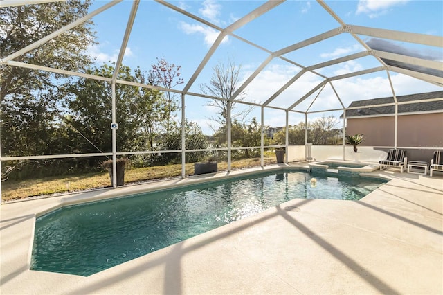 view of pool with an in ground hot tub, a lanai, and a patio area