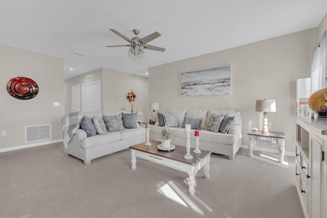 carpeted living room featuring ceiling fan