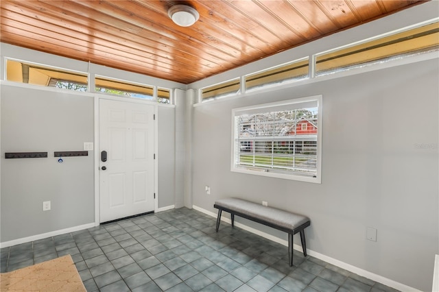 foyer with tile patterned flooring and wooden ceiling