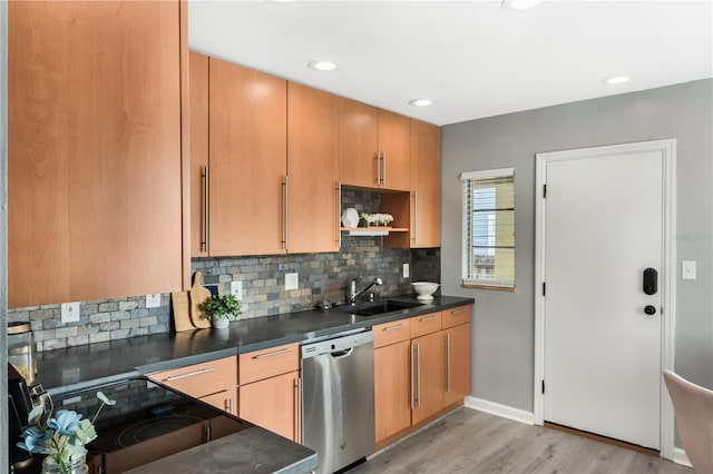 kitchen with electric stove, sink, light hardwood / wood-style flooring, backsplash, and stainless steel dishwasher